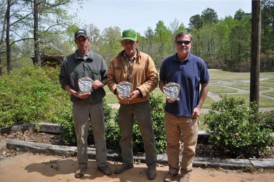 Christopher Grading Inc. tkaes home first place trophy at sporting clay event.